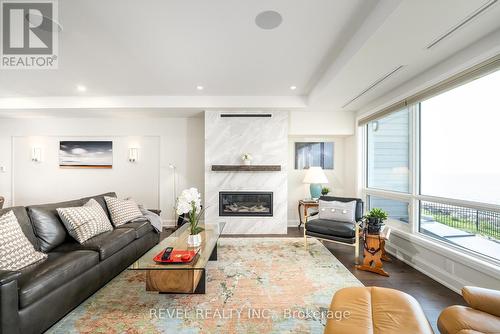 102 - 10 Dalhousie Avenue, St. Catharines, ON - Indoor Photo Showing Living Room With Fireplace