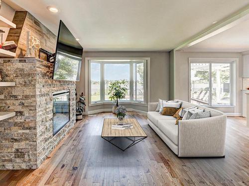 Salon - 10239 Boul. Gouin E., Montréal (Rivière-Des-Prairies/Pointe-Aux-Trembles), QC - Indoor Photo Showing Living Room With Fireplace