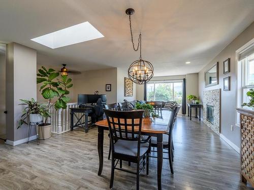 1050 Westminster Ave, Kamloops, BC - Indoor Photo Showing Dining Room With Fireplace