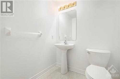 Powder room across from entrance on main floor. - 34 Stonemeadow Drive, Ottawa, ON - Indoor Photo Showing Bathroom