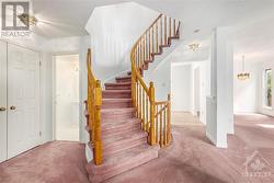 Gorgeous curved staircase to second level, Garage entrance, Laundry room and 2pcs bath to the left. - 