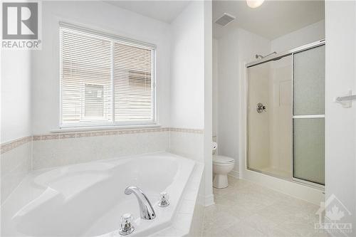 Ensuite bathroom, large corner tub, separate shower. - 34 Stonemeadow Drive, Ottawa, ON - Indoor Photo Showing Bathroom