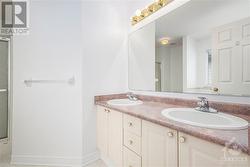 Ensuite bathroom, double sinks, plenty of storage. - 