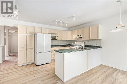 Well appointed kitchen filled with natural light, new flooring Kitchen, Dinette and Family room 2024. - 34 Stonemeadow Drive, Ottawa, ON - Indoor Photo Showing Kitchen