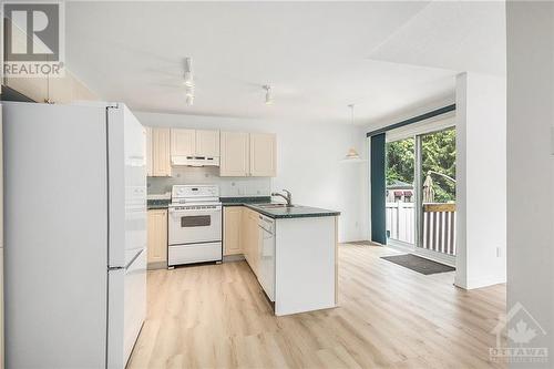 Dinette area with patio door for backyard access. - 34 Stonemeadow Drive, Ottawa, ON - Indoor Photo Showing Kitchen