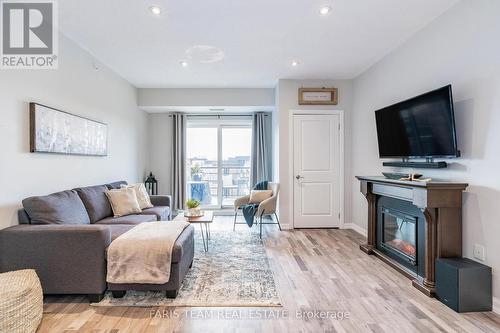 603 - 302 Essa Road, Barrie (400 West), ON - Indoor Photo Showing Living Room With Fireplace