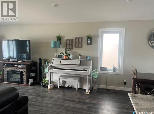 710 Maple Place, Warman, SK - Indoor Photo Showing Other Room With Fireplace