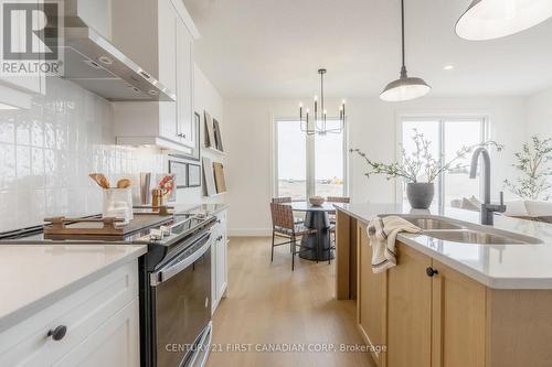 147-52 Scotts Drive, Lucan Biddulph (Lucan), ON - Indoor Photo Showing Kitchen With Double Sink With Upgraded Kitchen