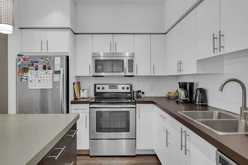 214-975 Academy Way, Kelowna, BC - Indoor Photo Showing Kitchen With Double Sink