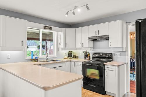 797 Heather Road, Lumby, BC - Indoor Photo Showing Kitchen With Double Sink