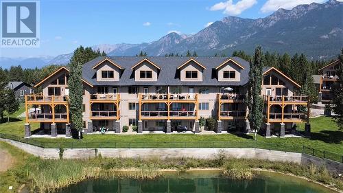 800 Bighorn Boulevard Unit# 816 C, Radium Hot Springs, BC - Outdoor With Body Of Water With Deck Patio Veranda With Facade