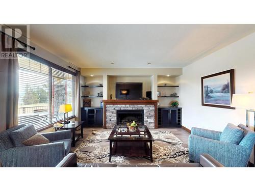 800 Bighorn Boulevard Unit# 816 C, Radium Hot Springs, BC - Indoor Photo Showing Living Room With Fireplace