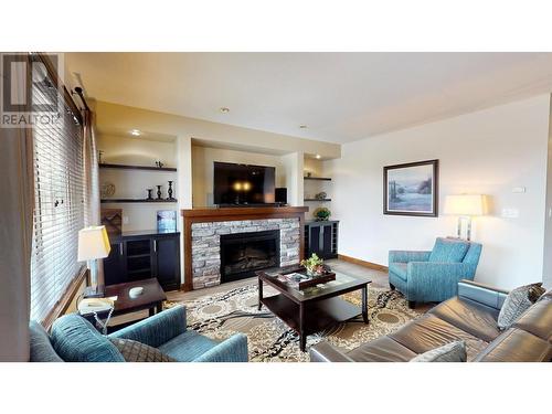 800 Bighorn Boulevard Unit# 816 C, Radium Hot Springs, BC - Indoor Photo Showing Living Room With Fireplace