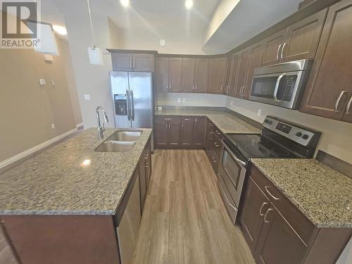 8711 82 Street, Fort St. John, BC - Indoor Photo Showing Kitchen With Double Sink