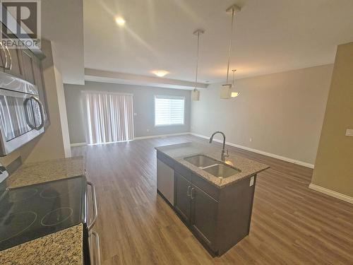 8711 82 Street, Fort St. John, BC - Indoor Photo Showing Kitchen With Double Sink