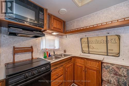 51 - 5216 County 90 Road, Springwater, ON - Indoor Photo Showing Kitchen With Double Sink