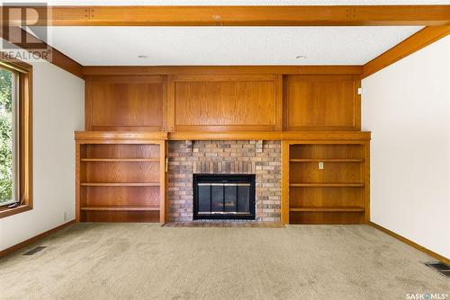 2610 Thornicroft Bay E, Regina, SK - Indoor Photo Showing Other Room With Fireplace