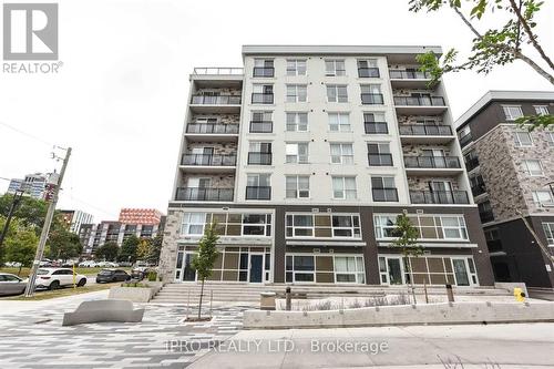 B211 - 275 Larch Street, Waterloo, ON - Outdoor With Balcony With Facade