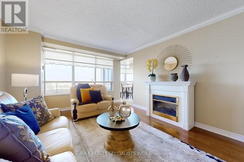 1705 - 35 Kingsbridge Garden Circle, Mississauga (Hurontario), ON - Indoor Photo Showing Living Room With Fireplace