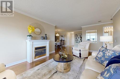 1705 - 35 Kingsbridge Garden Circle, Mississauga (Hurontario), ON - Indoor Photo Showing Living Room With Fireplace