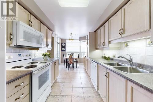 1705 - 35 Kingsbridge Garden Circle, Mississauga (Hurontario), ON - Indoor Photo Showing Kitchen With Double Sink