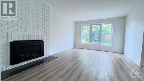 2111 Montreal Road Unit#191, Ottawa, ON - Indoor Photo Showing Living Room With Fireplace