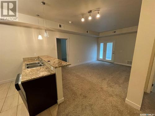 105 71 Riverwood Drive, Weyburn, SK - Indoor Photo Showing Kitchen With Double Sink