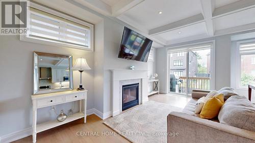 12 Chimney Swift Court, Toronto (Princess-Rosethorn), ON - Indoor Photo Showing Living Room With Fireplace