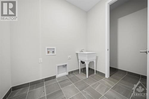 Upper Level Laundry Room - 91 Hackamore Crescent, Richmond, ON - Indoor Photo Showing Other Room