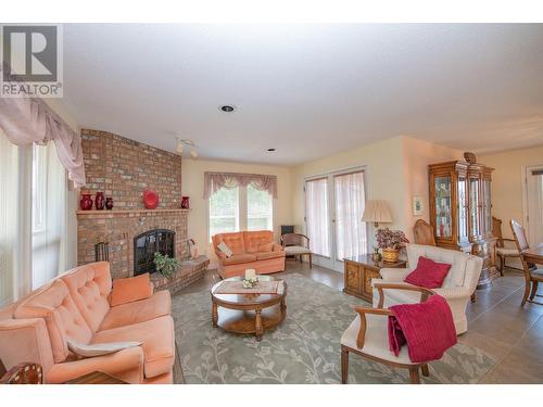 8816 Michael Drive, Coldstream, BC - Indoor Photo Showing Living Room With Fireplace