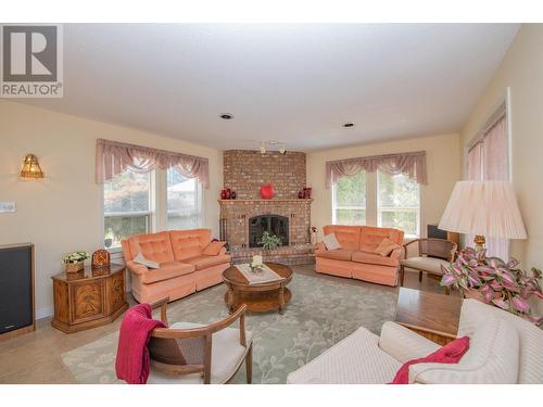 8816 Michael Drive, Coldstream, BC - Indoor Photo Showing Living Room With Fireplace