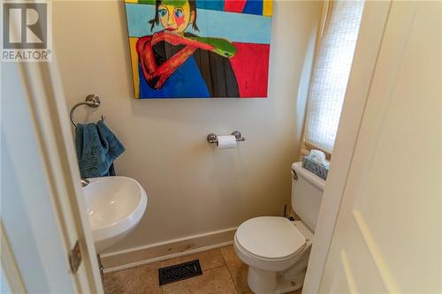 Main floor powder room directly off the laundry room - 343 Irving Street, Pembroke, ON - Indoor Photo Showing Bathroom