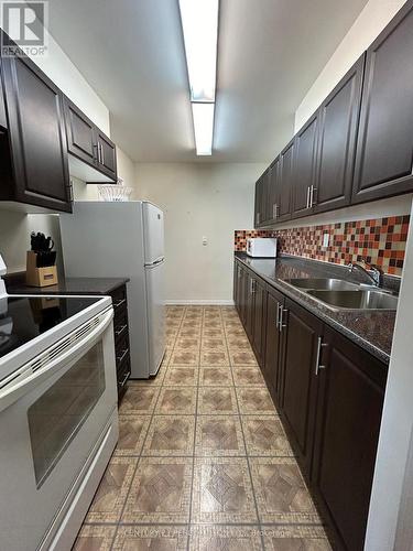 902 - 44 Longbourne Drive, Toronto (Willowridge-Martingrove-Richview), ON - Indoor Photo Showing Kitchen With Double Sink