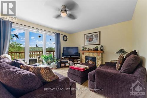 4666 Matawatchan Road, Greater Madawaska, ON - Indoor Photo Showing Living Room With Fireplace