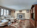 Salle familiale - 10 Rue Du Sauvignon, Kirkland, QC  - Indoor Photo Showing Living Room With Fireplace 