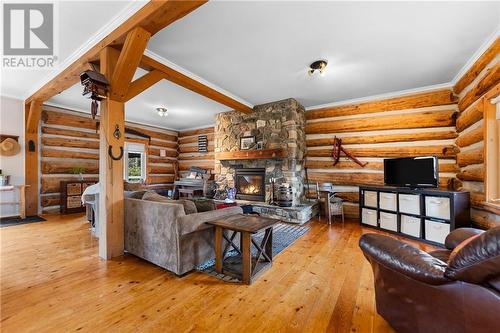 5253 River Road, Renfrew, ON - Indoor Photo Showing Living Room With Fireplace