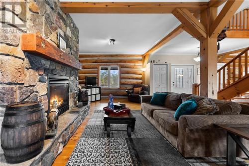 5253 River Road, Renfrew, ON - Indoor Photo Showing Living Room With Fireplace