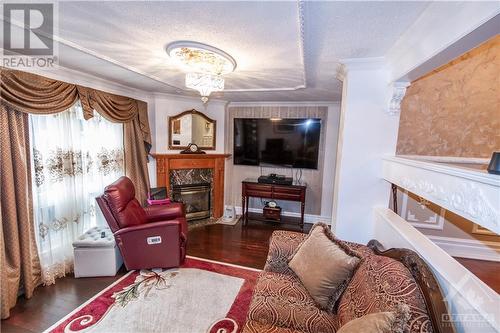 16 Larkshire Lane Unit#B, Ottawa, ON - Indoor Photo Showing Living Room With Fireplace