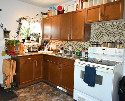 225 3Rd Avenue, Binscarth, MB - Indoor Photo Showing Kitchen With Double Sink