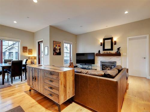 401-1335 Bear Mountain Pkwy, Langford, BC - Indoor Photo Showing Living Room With Fireplace