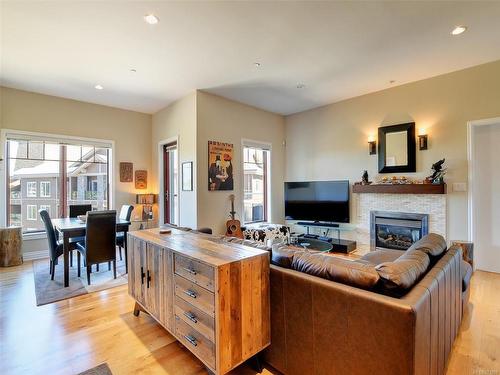 401-1335 Bear Mountain Pkwy, Langford, BC - Indoor Photo Showing Living Room With Fireplace