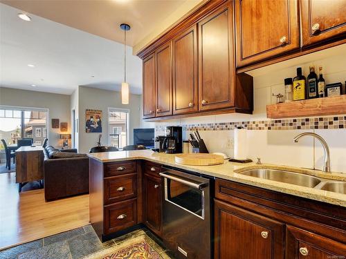 401-1335 Bear Mountain Pkwy, Langford, BC - Indoor Photo Showing Kitchen With Double Sink