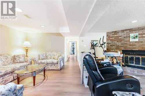 917 Roderick Avenue, Sudbury, ON - Indoor Photo Showing Living Room With Fireplace