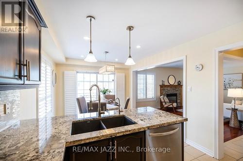 196 Millburn Drive, Clarington (Bowmanville), ON - Indoor Photo Showing Kitchen With Fireplace With Double Sink With Upgraded Kitchen