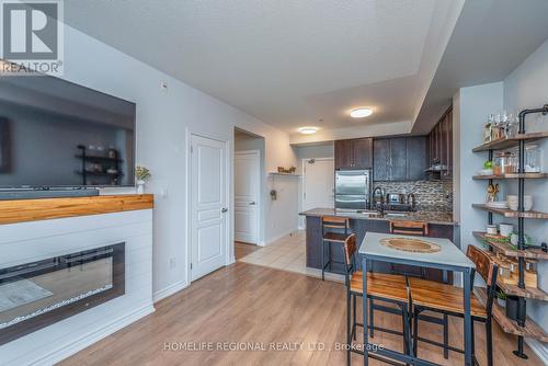 439 - 570 Lolita Gardens, Mississauga (Mississauga Valleys), ON - Indoor Photo Showing Living Room With Fireplace