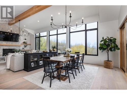 652 Trumpeter Road, Kelowna, BC - Indoor Photo Showing Dining Room With Fireplace