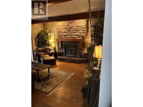 10701 Pinecrest Lane, Dawson Creek, BC - Indoor Photo Showing Living Room With Fireplace