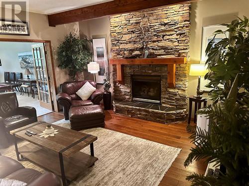 10701 Pinecrest Lane, Dawson Creek, BC - Indoor Photo Showing Living Room With Fireplace