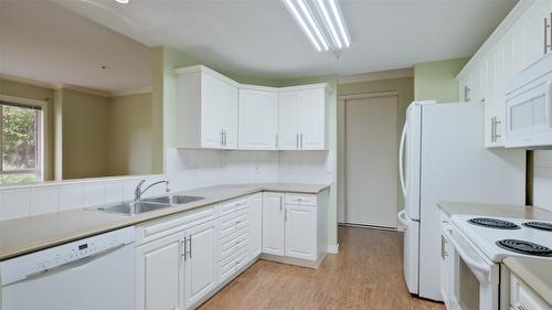 108-1962 Enterprise Way, Kelowna, BC - Indoor Photo Showing Kitchen With Double Sink