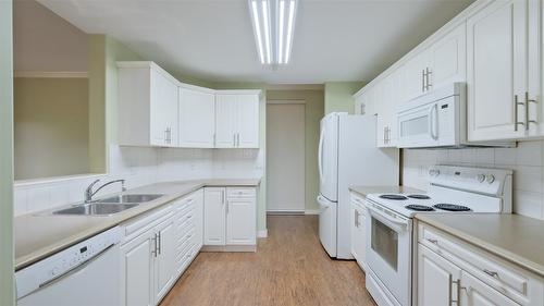 108-1962 Enterprise Way, Kelowna, BC - Indoor Photo Showing Kitchen With Double Sink